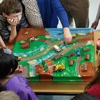 Kids learning about stormwater pollution with enviroscape